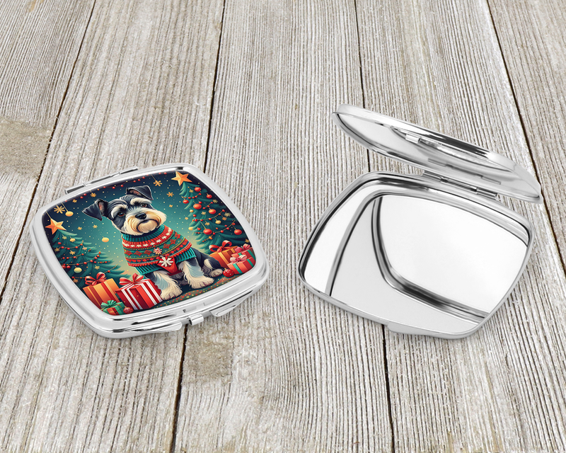Silver compact mirror open with Christmas schnauzer artwork on the lid panel