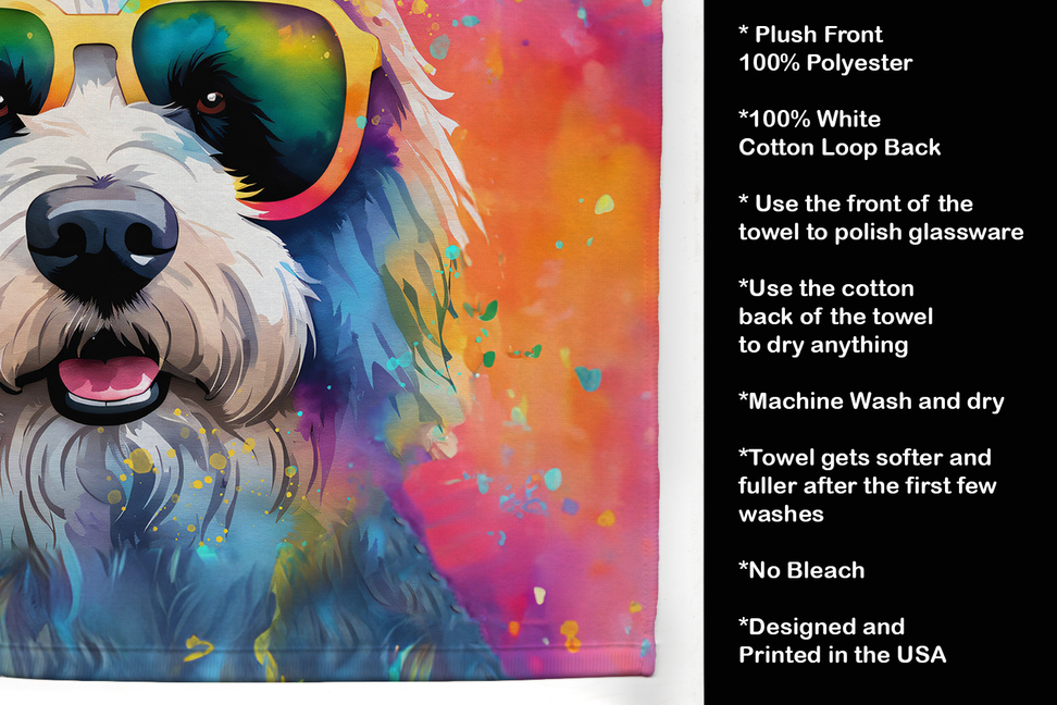 Close-up of colorful dog pot holder with care instructions and plush front label text.
