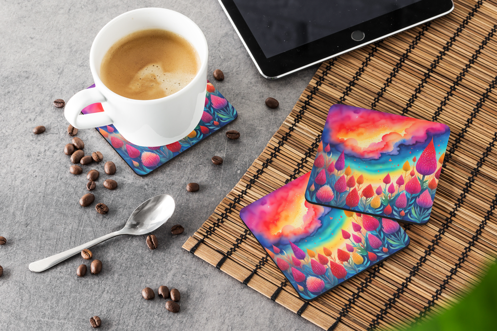 Chrysanthemum pot holder pair on bamboo mat near coffee cup, colorful floral cushion pads