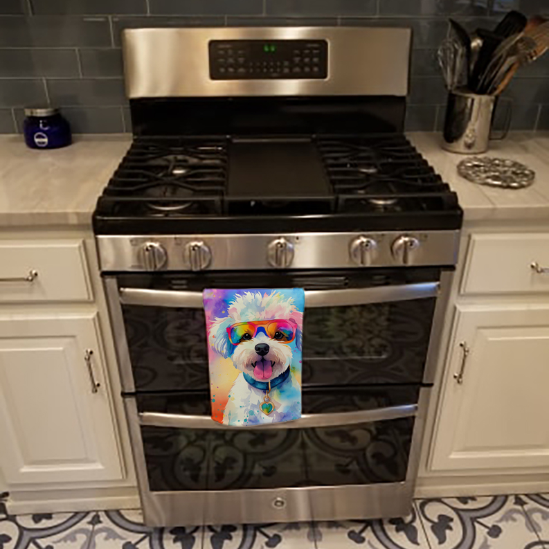 Pair of colorful dog print pot holders hanging on oven door