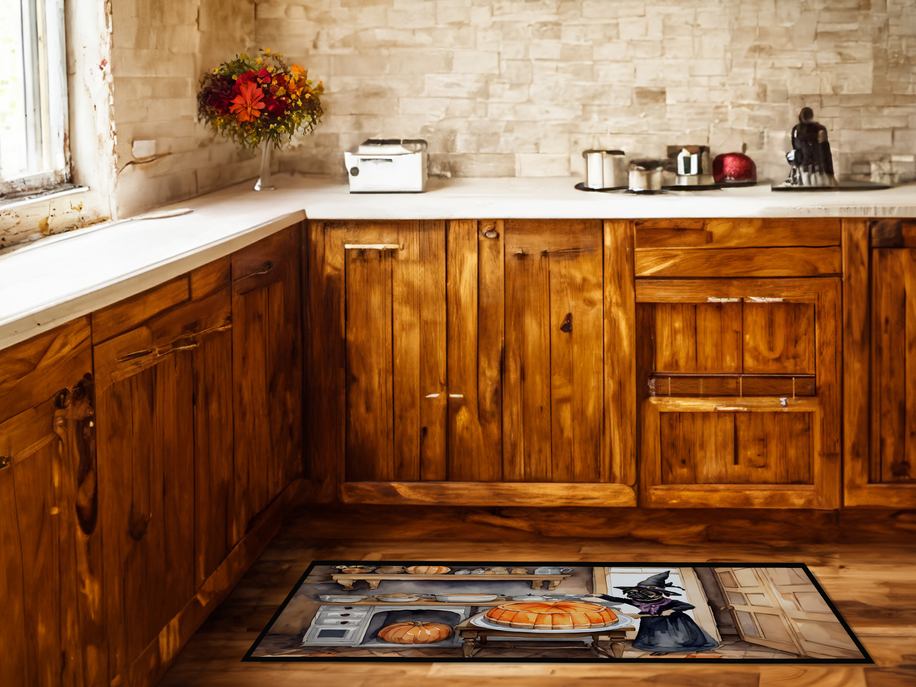 Fall kitchen mat with illustration of witch cat, pumpkins, and bats