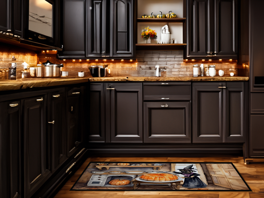 Fall kitchen mat with witch-cat and pumpkin artwork in a dark cabinet kitchen