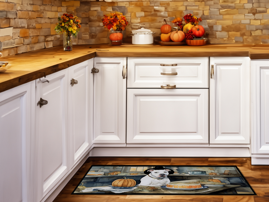 Decorative kitchen rug mat with white dog wearing orange pumpkins at center