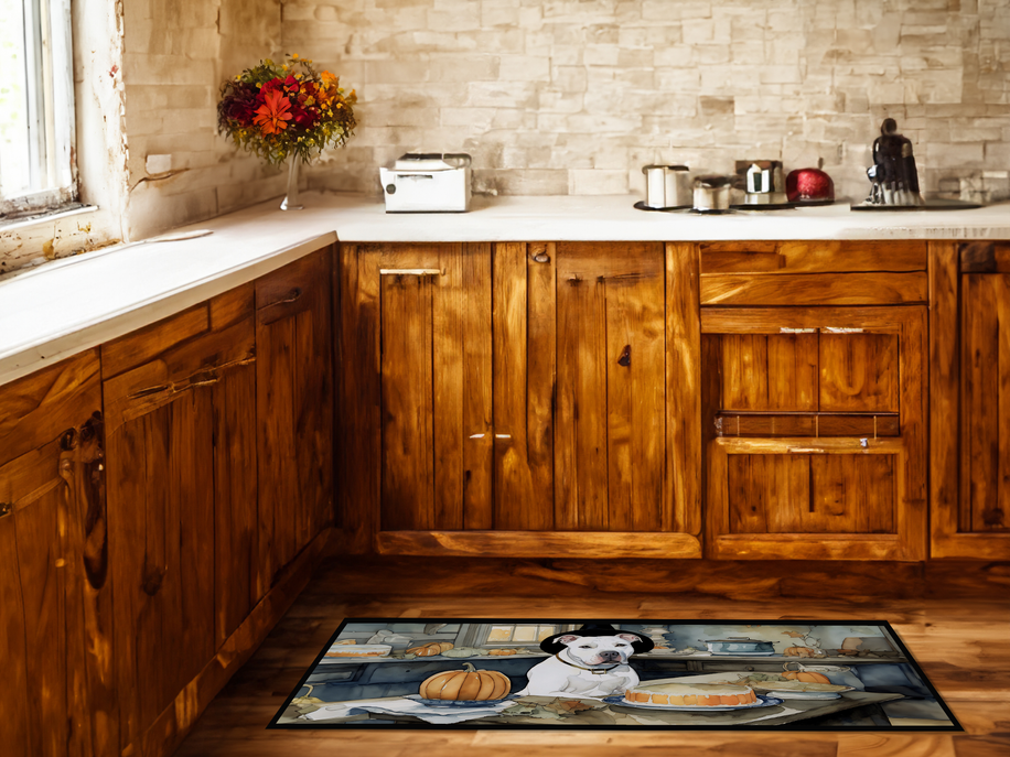 Decorative kitchen rug mat with white dog and pumpkins displayed on wooden kitchen floor