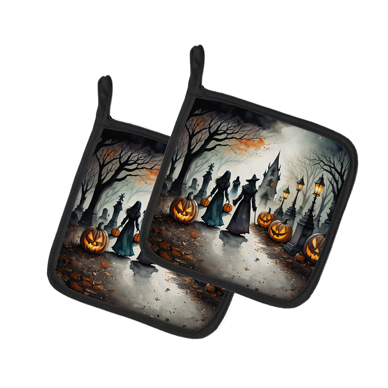 Set of two black-edged Halloween pot holders with haunted cemetery pumpkins print
