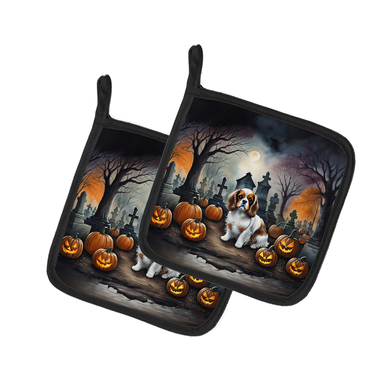 Pair of Halloween quilted pot holders with dachshund graveyard scene and black edging