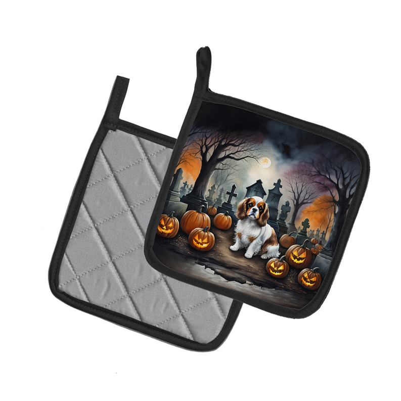 Set of two Halloween quilted pot holders with dachshund graveyard print and black trim