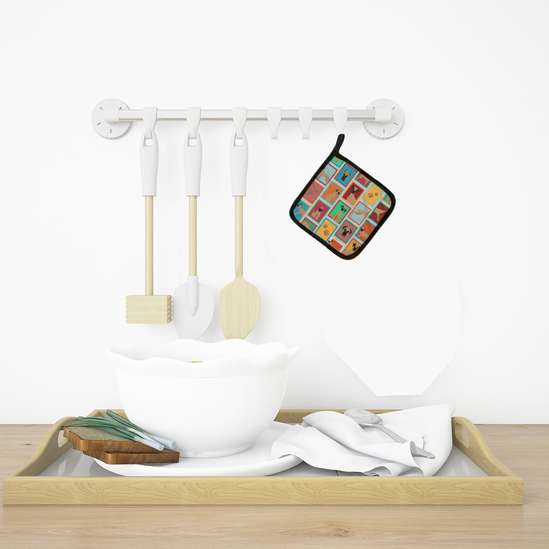 White ceramic bowl with wooden utensils on a wooden tray, colorful patterned pot holder hanging above.