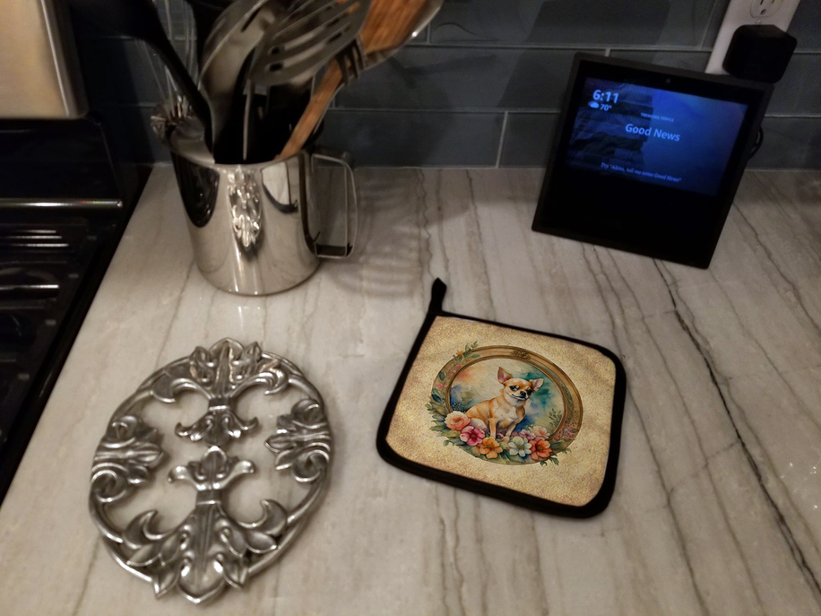 Foam coaster with black border and dog-in-flower wreath design on marble countertop