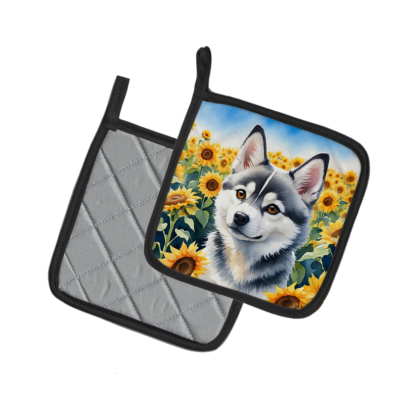Pair of pot holders showing quilted gray back panels with black trim