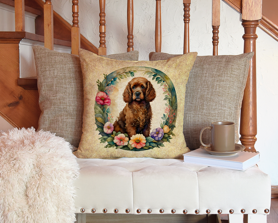 Decorative throw pillow with brown dog in floral wreath on beige fabric, centered