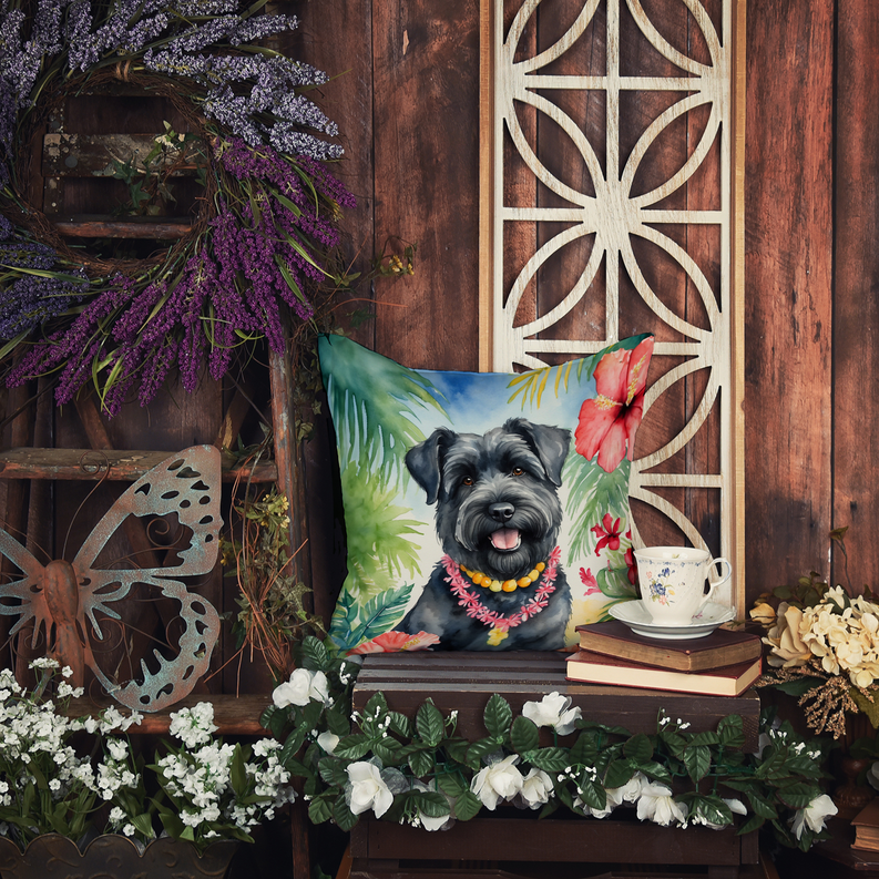 Decorative throw pillow with black dog portrait in tropical leaf and flower print