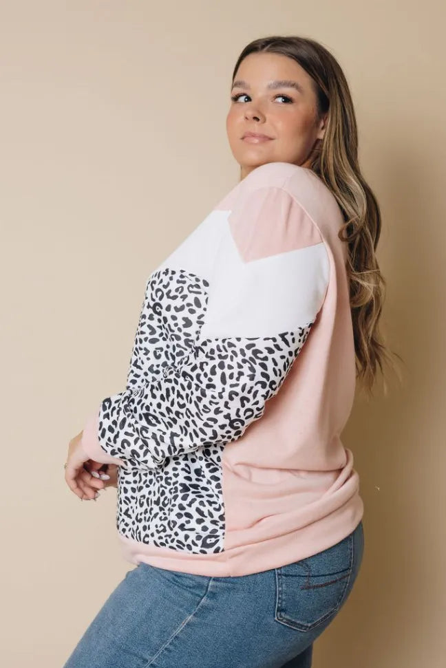 Plus size long sleeve top side view with leopard print panel and pink block