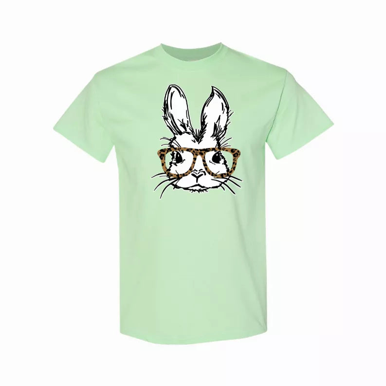 Mint green t-shirt with bunny graphic wearing leopard print glasses