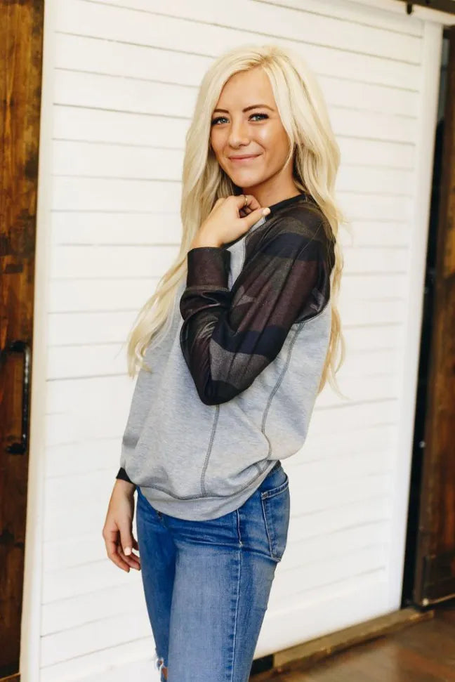 Camo crewneck pullover, heather gray body with dark camo quarter sleeves