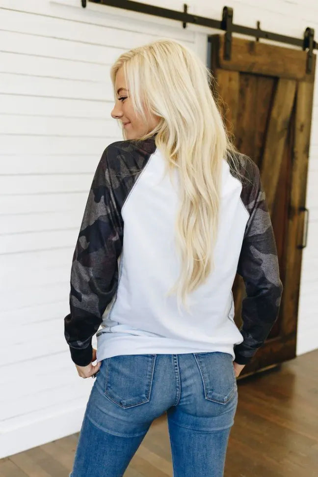 White crewneck pullover with dark camo long sleeves
