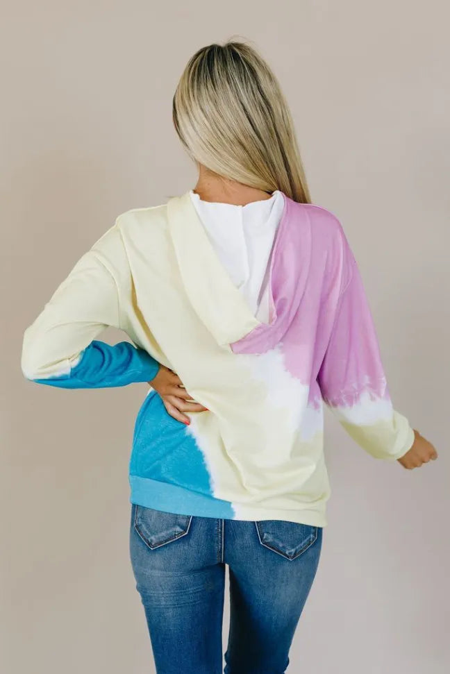 Colorblock tie-dye hoodie, back view with cream body, pink hood, and blue cuffs