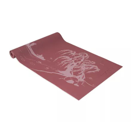 Maroon yoga mat with white line-art graphic, rolled edge visible
