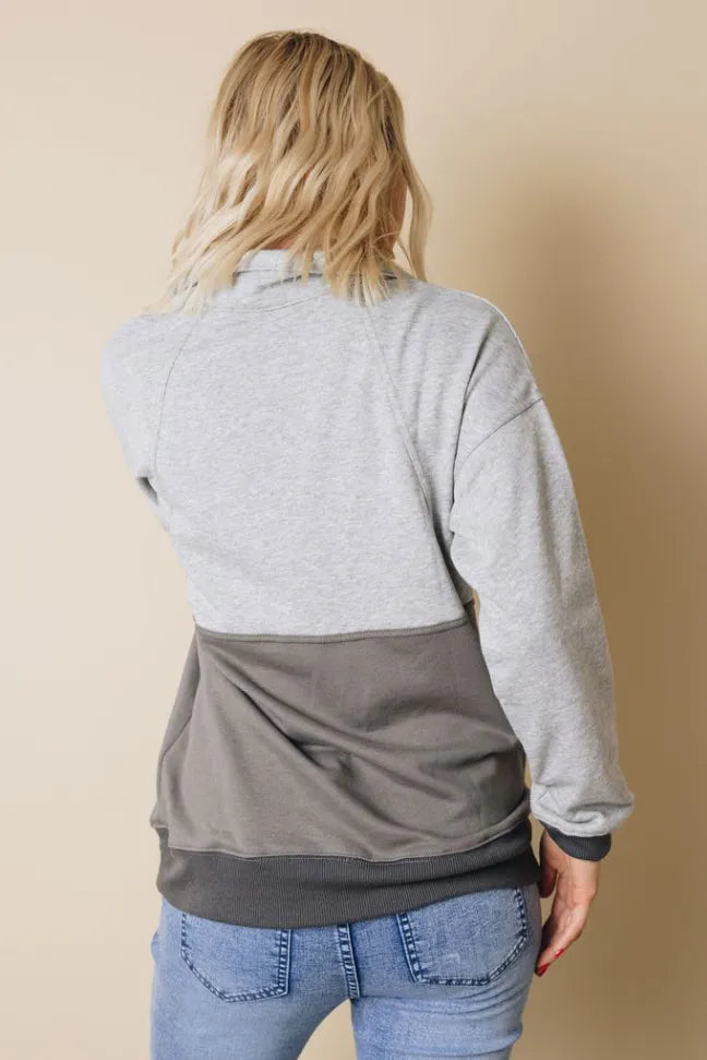 Back view of heather gray colorblock sweatshirt with dark gray lower panel