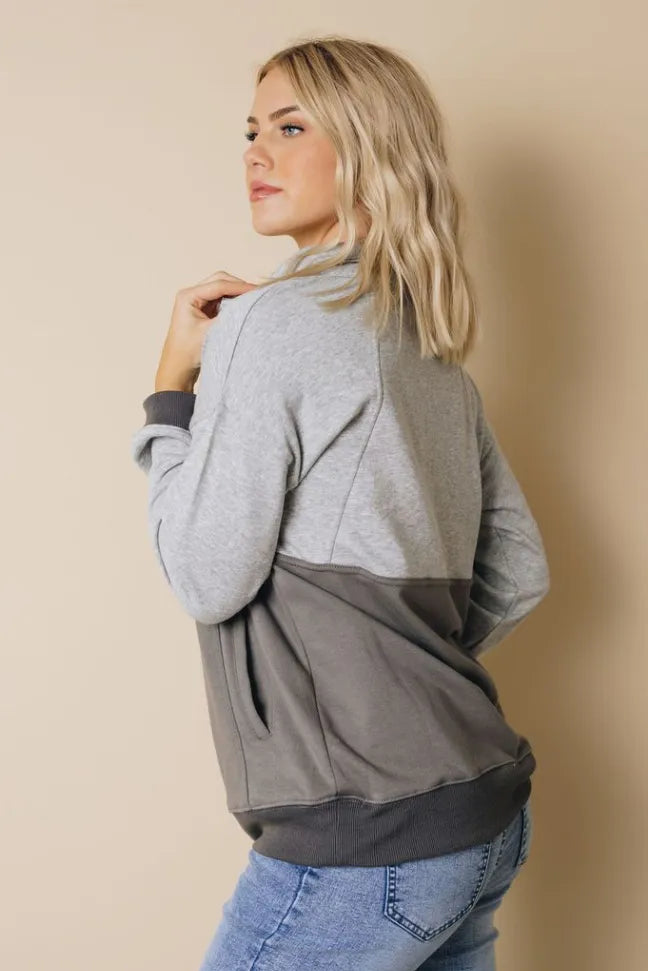 Colorblock half-zip sweatshirt with heather gray sleeves and dark gray body