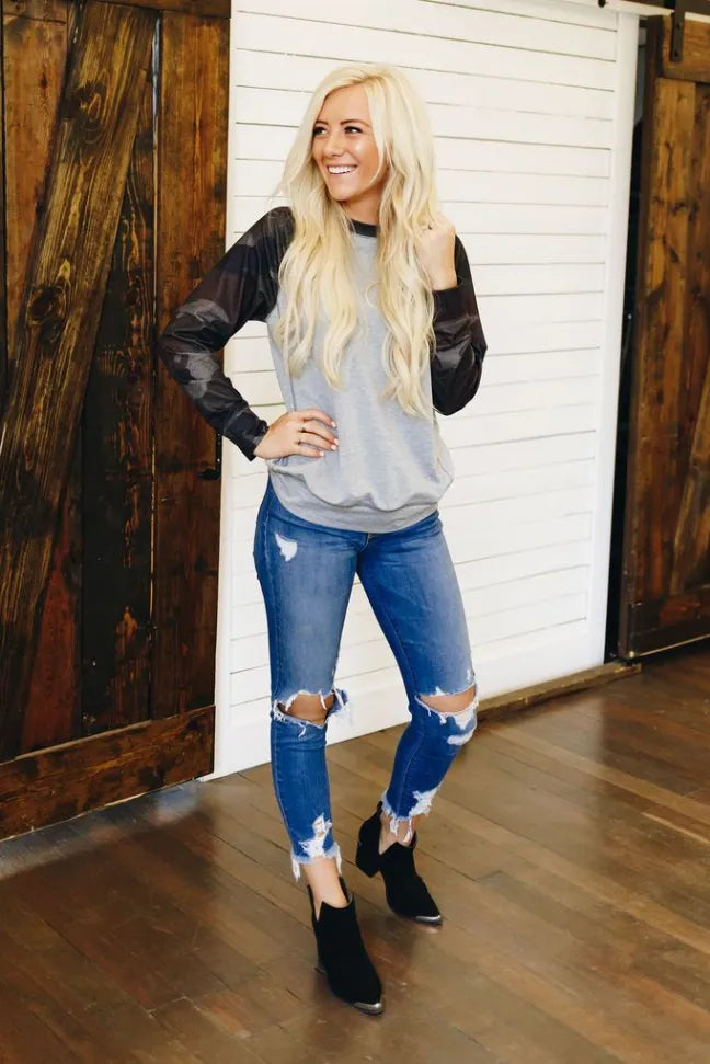 Crewneck pullover in heather gray with black camouflage raglan sleeves