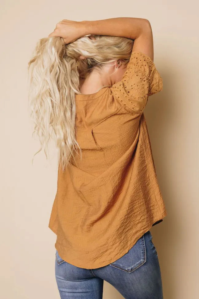 Camel brown pleated blouse with V-neck back and short sleeves