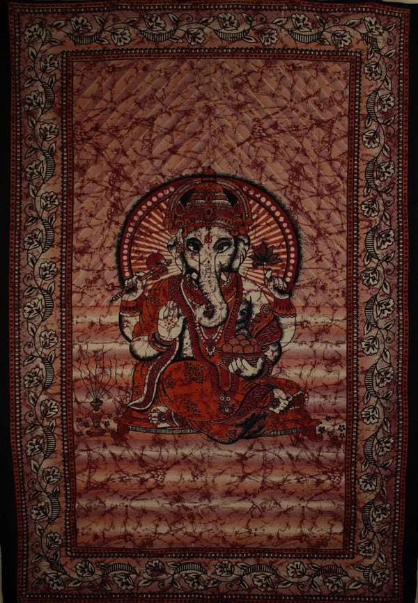 Batik-style tie-dye tapestry with seated Ganesha, red border and orange robe holding lotus