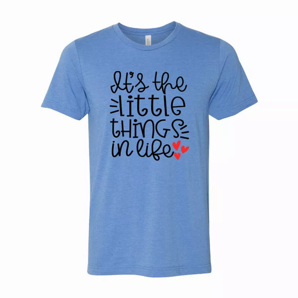 Light blue crew-neck graphic t-shirt with 'little things in love' text and hearts