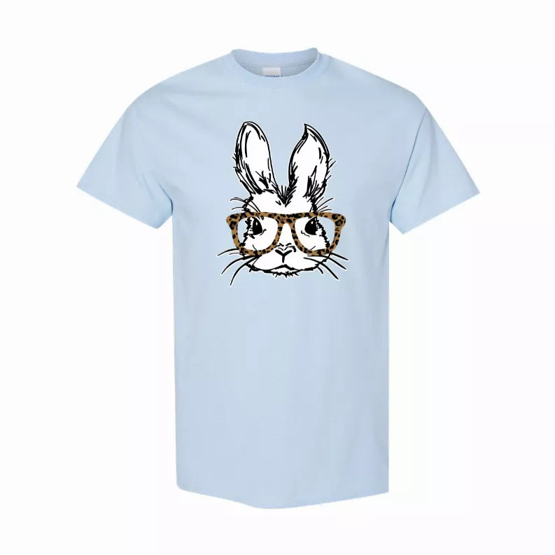 Light blue crew-neck T-shirt with bunny face wearing leopard-print glasses