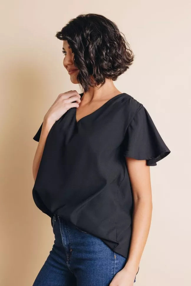 Women’s short-sleeve top in dark color, V-neck, ruffled sleeve cuff detail