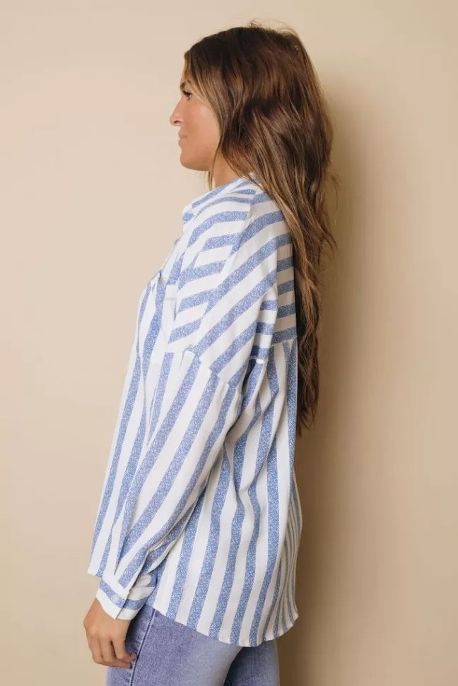 Blue and white striped button-down shirt on side view with long sleeves