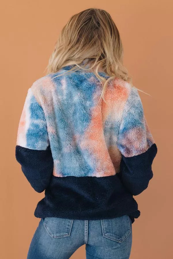Tie-dye fuzzy pullover with half-zip and black cuffs, back view