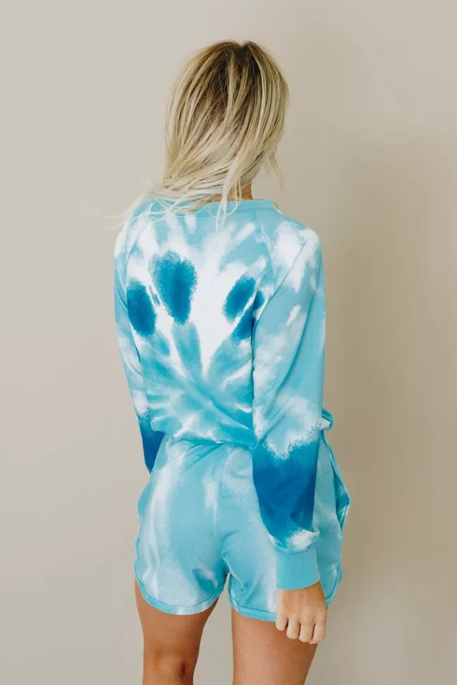 Blue tie-dye lounge set with long-sleeve crewneck top and drawstring shorts, back view