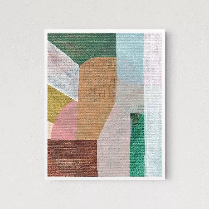Framed abstract wall art print with orange central form, green and blue angled shapes