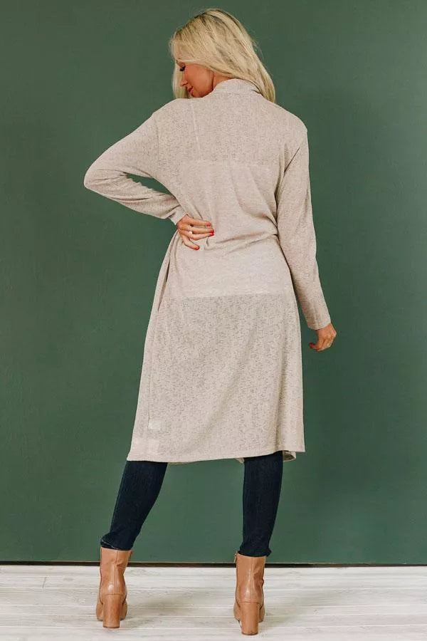 Light beige knit cardigan back view, long sleeves, long relaxed fit