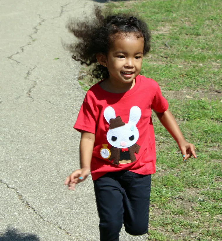 Kids red graphic T-shirt worn by child, white rabbit design with gold pocket watch
