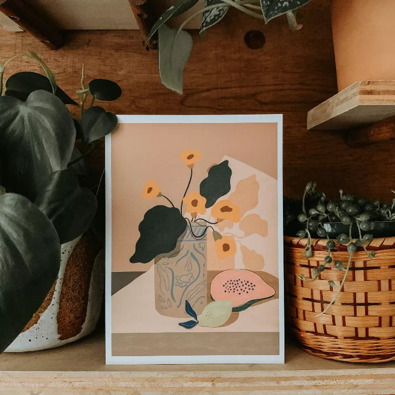 Framed botanical illustration print with yellow flowers, green leaves, and illustrated watermelon