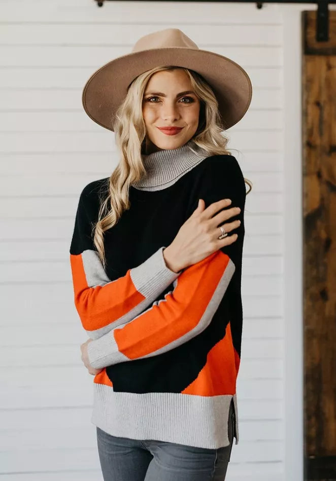 Color-block turtleneck sweater, black and orange color blocks with gray ribbed trim