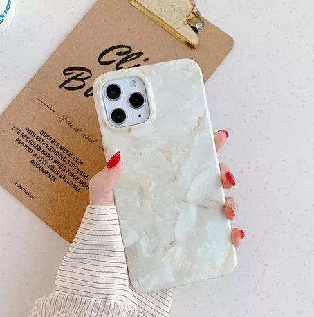 White marble iPhone case with raised camera bezel and slim protective edges