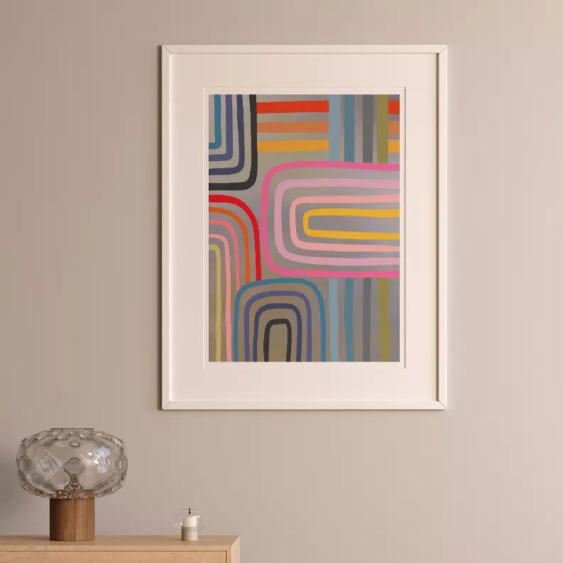 White-framed abstract geometric art print with stacked rainbow arch lines