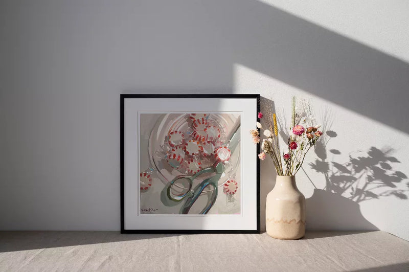 Framed abstract wall art print with red circular motifs over light grey and muted green