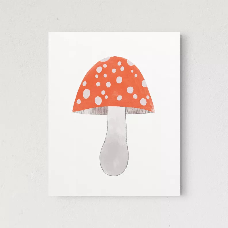 Framed mushroom wall art print featuring orange dotted cap and gray stem on white