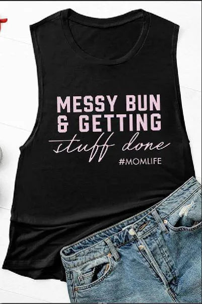 Black graphic tank top with scripted "stuff done" and #MOMLIFE, worn with jeans