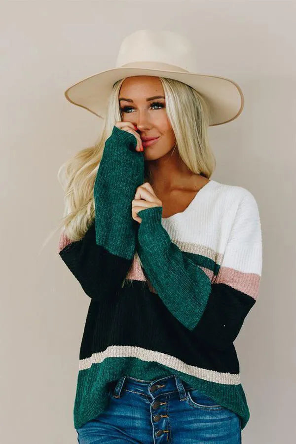 Candy striped knit sweater, front view with white, pink, black, and dark green striped knit