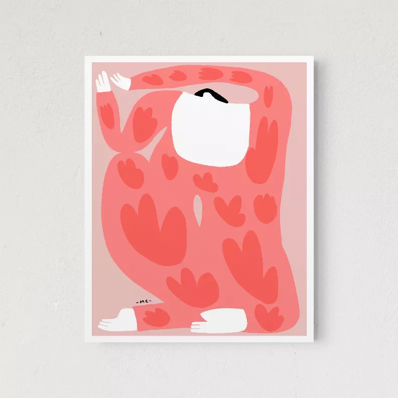 Framed wall art close-up: red camouflage pattern with white cat, light pink mat