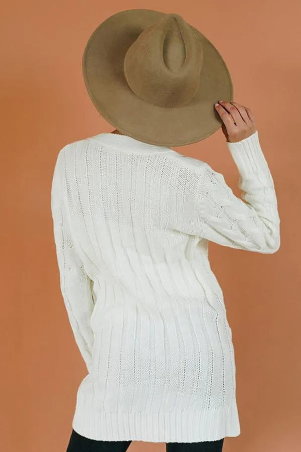 White knit cardigan sweater, ribbed cuffs and hem, cable texture back view