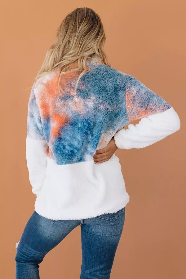 Tie-dye fuzzy pullover half-zip, back view with blue/orange patches and white sleeves