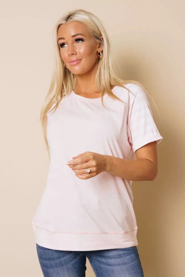 Pink short-sleeve crewneck T-shirt, front view with easy drape.