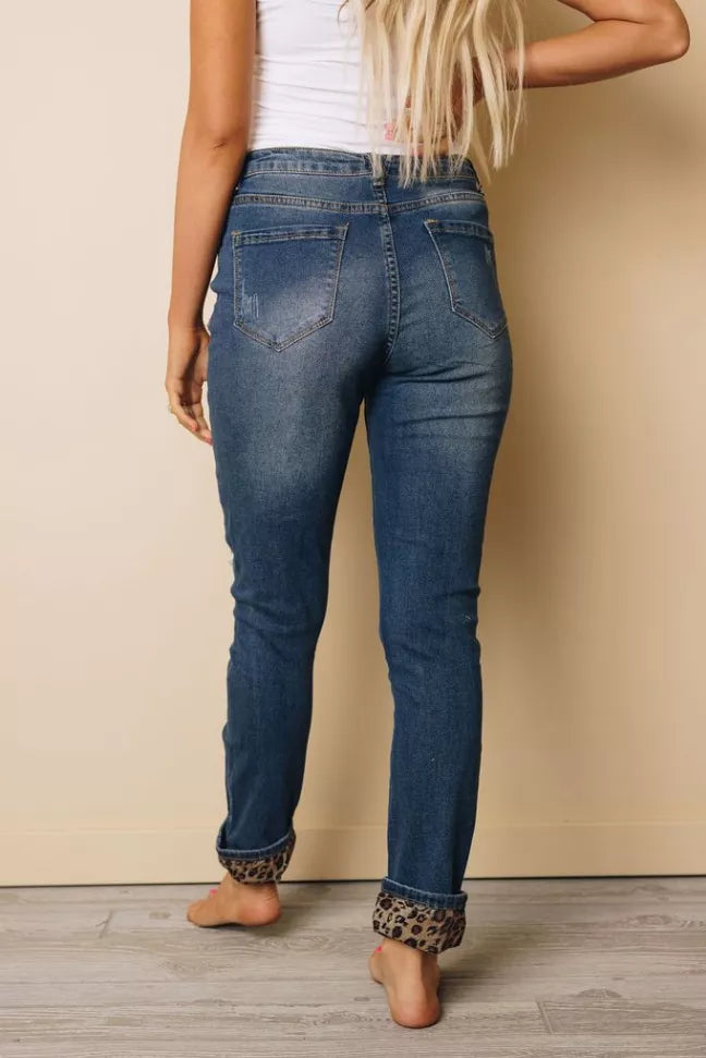 Blue distressed jeans with leopard ankle cuffs, mid-rise five-pocket design