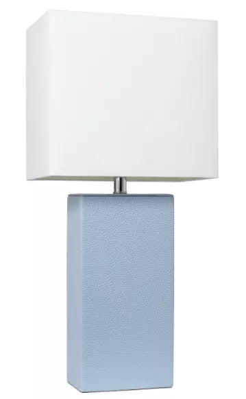 Modern table lamp with white fabric shade and textured blue leather-look base